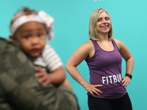 Amanda Brindley teaches a class to moms with babies at Fitbump, the fitness studio she opened on Cynthia Street earlier this year.