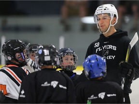 Philadelphia Flyers' Taylor Leier coaches kids at the Star-Powered Kids on Ice Camp at Schroh Arena in Saskatoon on July 18, 2016.