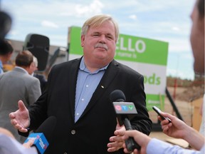 Save-On-Foods president Darrell Jones speaks with reporters following the groundbreaking ceremony for the first of three stores the company plans to open in Saskatoon.