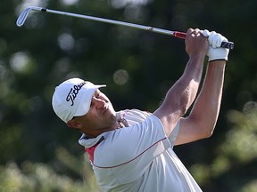 Tyler Wright hits the ball from the fairway during the Saskatchewan Mid-Am men's golf championships at Moon Lake golf course on July 6, 2016.