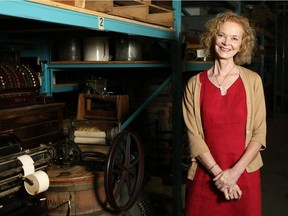 Joan Champ, former CEO of the Western development Museum, stands in the Curatorial Centre's storage rooms.