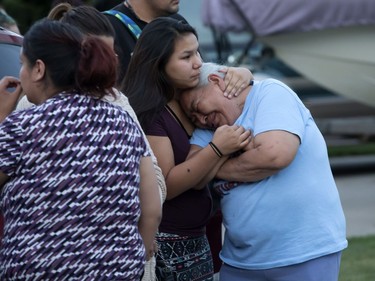 Family and friends were overcome with emotion as they attend a candlelight vigil on Waterloo Crescent in Saskatoon for six-week-old Nikosis Jace Cantre, July 5, 2016. A 16-year-old young offender has been charged with second-degree murder in the death.