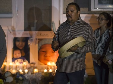 People attend a candlelight vigil on Waterloo Crescent in Saskatoon for six-week-old Nikosis Jace Cantre, July 5, 2016. A 16-year-old young offender has been charged with second-degree murder in the death.