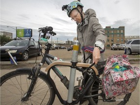 Cathy Watts, co-chair of Saskatoon Cycles locks up her bike prior to a downtown meeting, Tuesday, July 12, 2016. For story on roots of bike theft problem in the city.