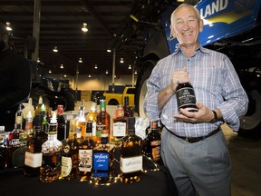 Jan Westcott, the head of Sprits Canada, a national trade organization representing distillers at the Spirits Canada booth at the Sask Wheat Growers BBQ in Saskatoon, Wednesday, July 20, 2016.
