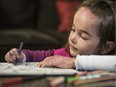 Syrian refugee Sham Khantoumani, a five-year-old who was born with Epidermolysis Bullosa, colours in a colouring book at her home in Saskatoon. Children with Epidermolysis Bullosa often called 'Butterfly Children' because as the analogy goes, their skin is as fragile as the wings of a butterfly.