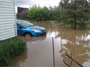 The yard of Janice Schreiner in Elfros, Saskatchewan, after the town fell victim to severe flash flooding on July 23, 2016.