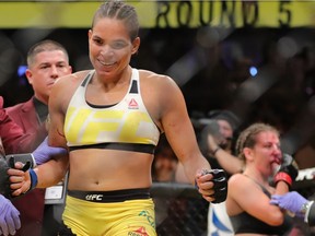 Amanda Nunes celebrates his victory over Miesha Tate during the UFC 200 event at T-Mobile Arena on July 9, 2016 in Las Vegas, Nevada.