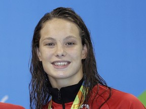 From left Canada's Sandrine Mainville, Chantal Van Landeghem,Taylor Ruck and Penny Oleksiak, show off their bronze medals after the women's 4x100-meter freestyle final during the swimming competitions at the 2016 Summer Olympics, Saturday, Aug. 6, 2016, in Rio de Janeiro, Brazil. (AP Photo/Michael Sohn) ORG XMIT: OSWM484