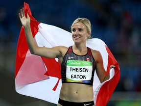 Brianne Theisen-Eaton celebrates to winning bronze in the heptathlon at the Olympic Games on Aug. 13, 2016, in Rio de Janeiro, Brazil.