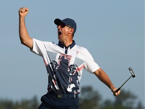 Justin Rose of Great Britain celebrates winning in the final round of men's golf on Day 9 of the Rio 2016 Olympic Games at the Olympic Golf Course on August 14, 2016 in Rio de Janeiro, Brazil.