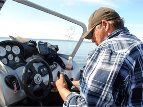 After cell towers in Black Lake became operational in December 2015, Black Lake band councillor John Toutsaint can use his cellphone even while fishing on Black Lake.