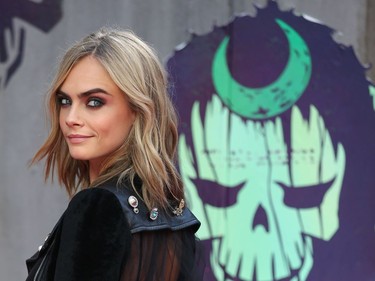 British model and actor Cara Delevingne poses as she arrives at the European premiere of "Suicide Squad" in London, England, August 3, 2016.