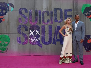 Australian actor Margot Robbie and US actor Will Smith pose as they arrive at the European premiere of "Suicide Squad" in London, England, August 3, 2016.