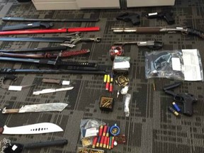 Saskatoon police were processing 85 evidence exhibits, including bicycles, a lawn mower, tools, two guns, cash and methamphetamine, which were seized during raids of two homes in the 300 block of Avenue J South on August 4, 2016.