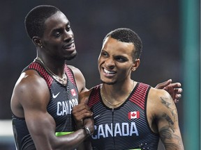 Canada's Andre De Grasse, right, and Brendon Rodney react following the men's 4x100-metre relay final at the 2016 Summer Olympics in Rio de Janeiro, Brazil on Friday, August 19, 2016.