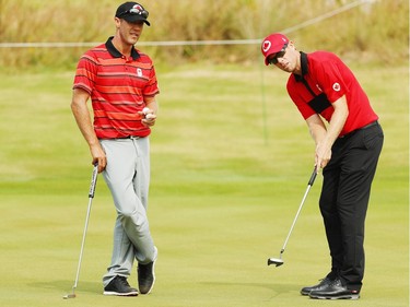 RIO DE JANEIRO, BRAZIL - AUGUST 08:  Graham Delaet (L) and David Hearn of Canada look over a green during a practice round during Day 3 of the Rio 2016 Olympic Games at Olympic Golf Course on August 8, 2016 in Rio de Janeiro, Brazil.