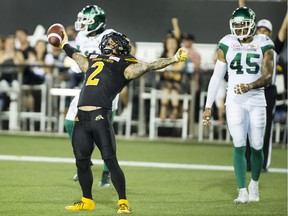 Chad Owens celebrates one of the Hamilton Tiger-Cats' six touchdown receptions against the visiting Saskatchewan Roughriders on Saturday.