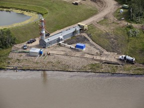 Husky crews work to clean up an oil spill on the North Saskatchewan river near Maidstone, Sask on Friday July 22, 2016.