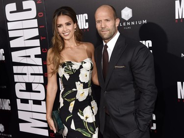 Jessica Alba and Jason Statham pose together at the premiere of "Mechanic: Resurrection" at the ArcLight Hollywood, August 22, 2016 in Los Angeles, California.