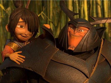 L-R: Kubo (voiced by Art Parkinson) gets a lift from his new friend and ally Beetle (voiced by Matthew McConaughey) in "Kubo and the Two Strings."