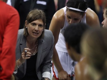 Canada head coach Lisa Thomaidis talks to the team during the second half of a women's basketball game against Serbia at the Youth Center at the 2016 Summer Olympics in Rio de Janeiro, Brazil, Monday, Aug. 8, 2016. Canada defeated Serbia 71-67. AP Photo/Carlos Osorio) ORG XMIT: OBKL120