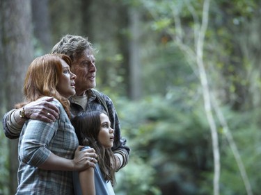 L-R: Bryce Dallas Howard is Grace, Robert Redford is Mr. Meacham and Oona Laurence is Natalie in Disney's "Pete's Dragon," the adventures of a boy named Pete and his best friend Elliot, who just happens to be a dragon.