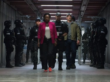 C-R: Viola Davis as Amanda Waller, Ike Barinholtz as Griggs and Joel Kinnaman as Rick Flag in "Suicide Squad."