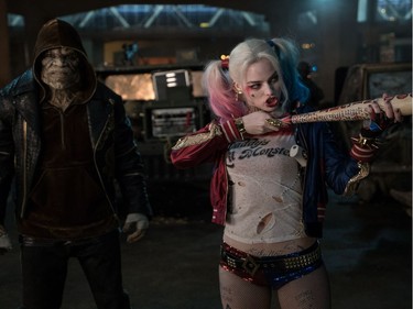 Adewale Akinnuoye-Agbaje as Killer Croc and Margot Robbie as Harley Quinn in Warner Bros. Pictures' action adventure "Suicide Squad."