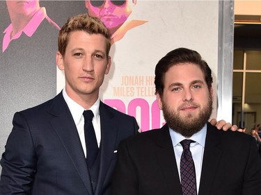 Actors Miles Teller (L) and Jonah Hill attend the premiere of Warner Bros. Pictures' "War Dogs" at TCL Chinese Theatre on August 15, 2016 in Hollywood, California.