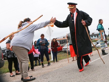 Prince Albert police Chief Troy Cooper and a group of other men wore red high heels during the annual Walk for Missing and Murdered Indigenous women at Ahtahkakoop First Nation on Aug. 23, 2016.