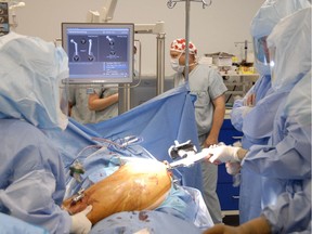 A hip replacement procedure being performed at Surrey Memorial Hospital.