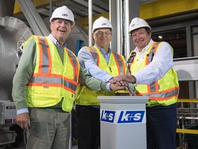 Ralf Bethke, chairman of K+S AG's supervisory board; Norbert Steiner, K+S AG chairman; and K+S Potash Canada president and CEO Ulrich Lamp press the start button at the German company's $4.1 billion Legacy solution mine near Bethune.