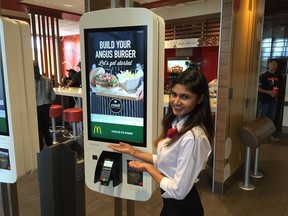 Shraddha Gaire demonstrates McDonald's Canada Inc.'s new Create Your Taste technology at the Habour Landing McDonald's restaurant in Regina.