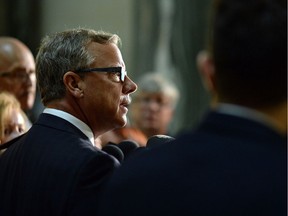 Saskatchewan Premier Brad Wall speaks to journalists at the Legislative Building about Don McMorris's resignation from cabinet and caucus after being charged with impaired driving