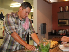 Rich Francis, left Chef and owner of Seventh Fire Indigenous Cuisine and Rachel Eyahpaise, owner of Bannock Express, work together in the kitchen at the Saskatoon Farmers Market ahead of a pop-up restaurant event that took place earlier this week. The two said preparing First Nations cuisine is about more than the dish, as they're reclaiming a genre of cuisine that was lost to colonization. (Morgan Modjeski/The Saskatoon StarPhoenix).
