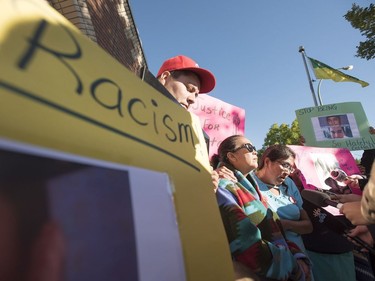 Christine Deene (R) the aunt of Colten Boushie, stands with his mother Debbie as they speak with media while family, friends and supporters hold signs during a rally outside of the Saskatchewan Provincial Court in North Battleford, August 18, 2016. People held a rally outside a Saskatchewan courthouse Thursday where a farmer accused of fatally shooting a First Nations man is to make an appearance.