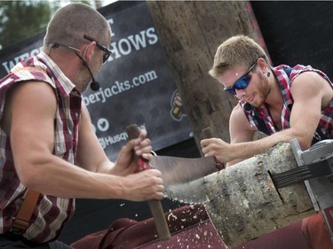 Darren Dean of the West Coast Amusement Lumberjack Show and his partner in the sawing logs portion of the show at the Saskatoon Ex, August 10, 2016.