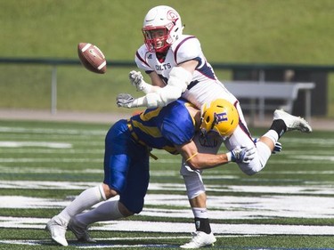 A Calgary Colts receiver is crushed loosing this reception after a big hit by Saskatoon Hilltops Adam Benkie who was injured on the play, August 28, 2016.