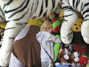 You can loose money pretty quickly trying to win the biggest prize with the games of chance on the Saskatoon Ex midway, August 9, 2016.