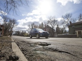 Drivers attempt to avoid potholes near the intersection of Clarence Avenue North and Osler Street on Thursday, March 31st, 2016. (Liam Richards/Saskatoon StarPhoenix)