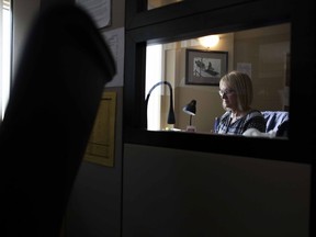 Rita Field, the Executive Director of the Saskatoon Crisis Intervention Service sits in one of the call centre desks in Saskatoon, Saskatchewan on Friday, August 12th, 2016.