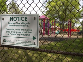 A city of Saskatoon sign warns park goers that the old Kinsmen play village is now closed.