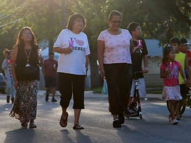 People gather to remember victims of the sex trade during the 16th Annual Day or Mourning Event at Pleasant Hill Park on August 14, 2016.