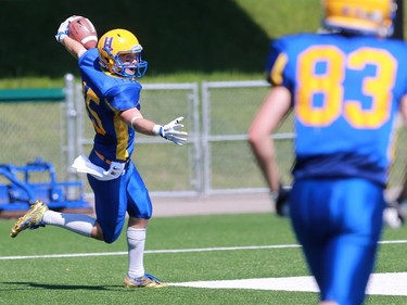 Saskatoon Hilltops' Ryan Turple scores a touchdown during the first half of their 2016 Prairie Football Conference season-opener against the Winnipeg Rifles at SMF Field on August 14, 2016.