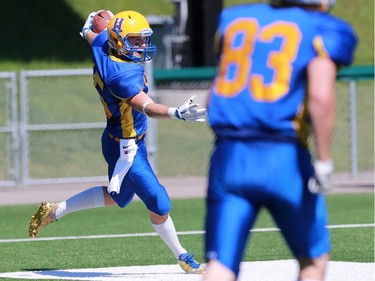 Saskatoon Hilltops' Ryan Turple scores a touchdown during the first half of their 2016 Prairie Football Conference season-opener against the Winnipeg Rifles at SMF Field on August 14, 2016.