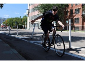 A cyclist uses the bike lane on 23rd Avenue in Saskatoon on August 2, 2016.