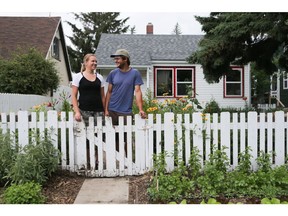 Lisa Taylor and her husband Jason Fege at their Riversdale home which is a diverse ecosystem filled with flowers, herbs, vegetables, compost, bees, birds and all things organic in Saskatoon on July 6, 2016. (Michelle Berg / Saskatoon StarPhoenix)