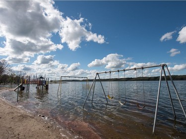 A playground structure sits underwater in Manitou Beach, SK on Friday, August 5, 2016.