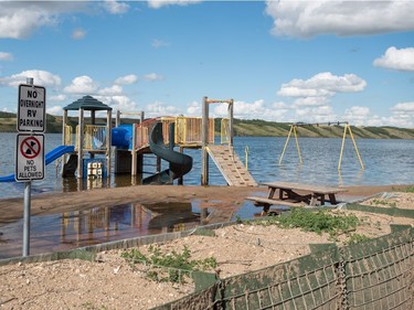 A playground structure sits underwater in Manitou Beach, SK on Friday, August 5, 2016.